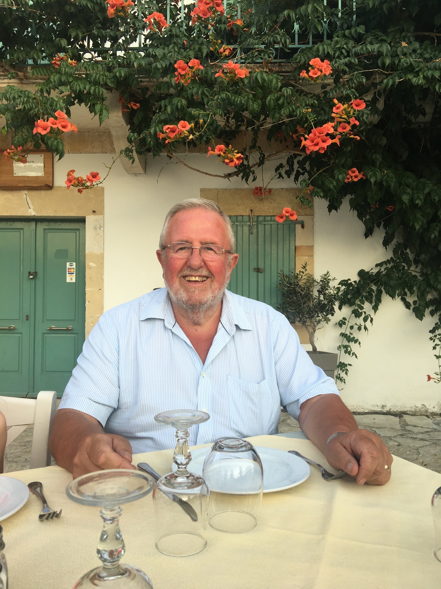John Booth smiling outdoors