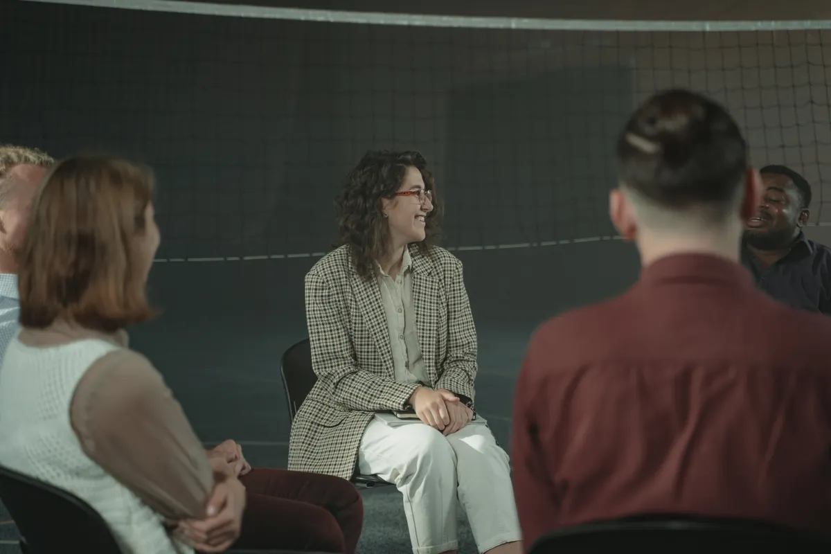 Adults taking part in a facilitated community discussion